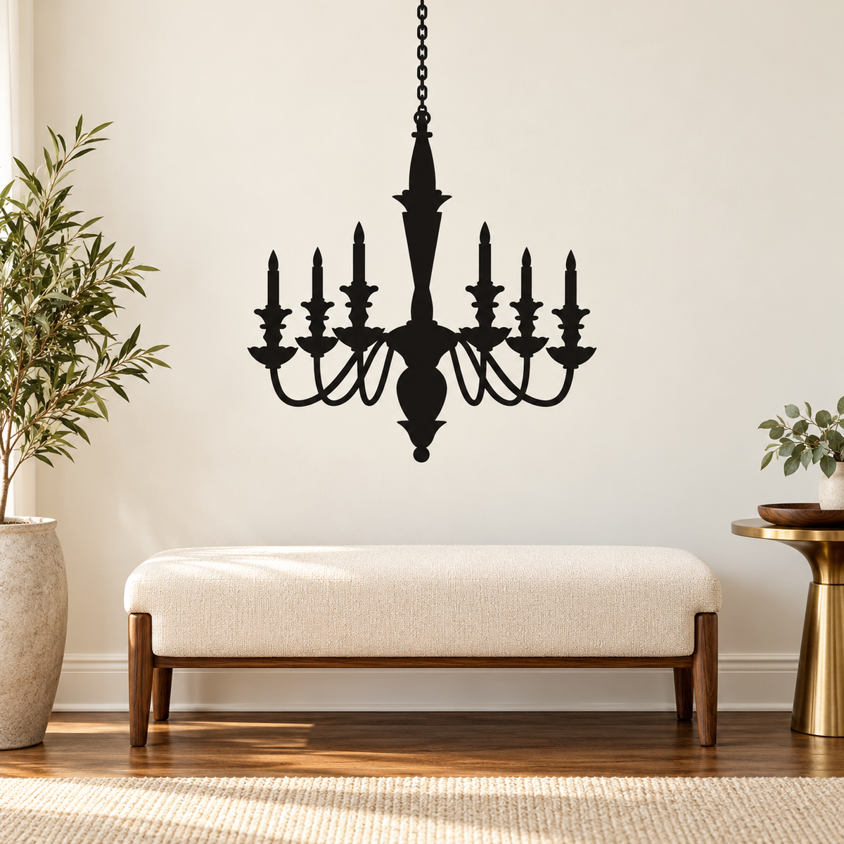 Black antique chandelier wall decal above a cream bench