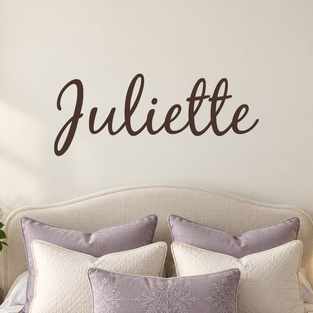 Close-up custom lettering example on a smooth wall