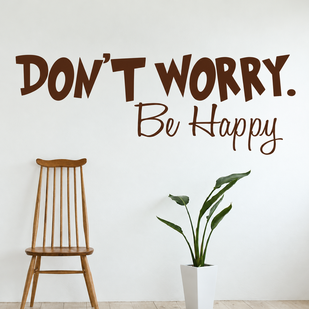 Don't worry be happy wall quote above a wooden chair