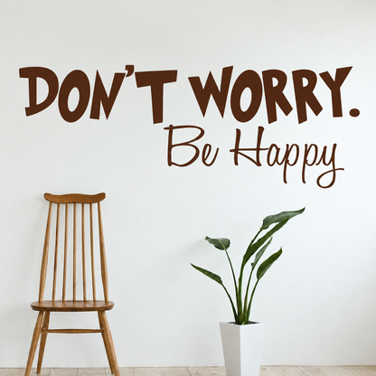 Don't worry be happy wall quote above a wooden chair