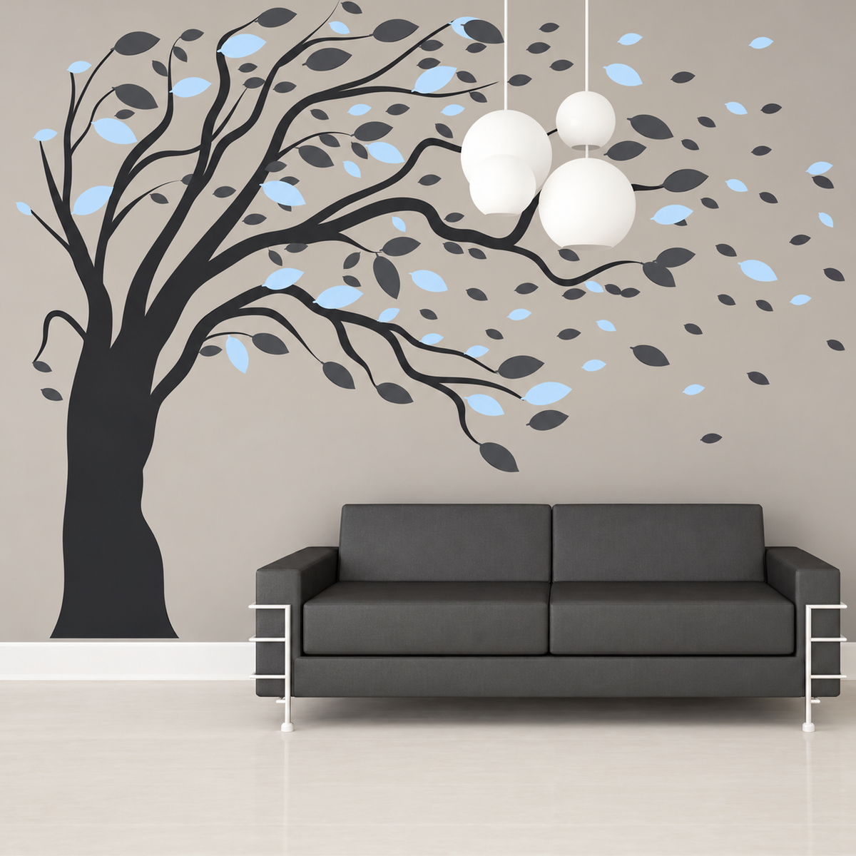 Blowing tree decal with blue and grey leaves above sofa