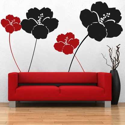 Black and red flower wall decals above a red sofa