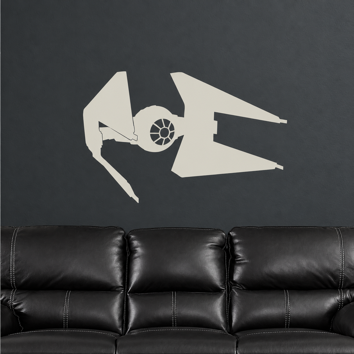Cream space fighter decal above black leather sofa, enhanced original secondary photo