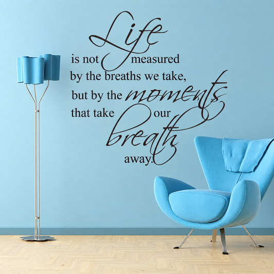 Life moments and breath wall quote on a blue wall