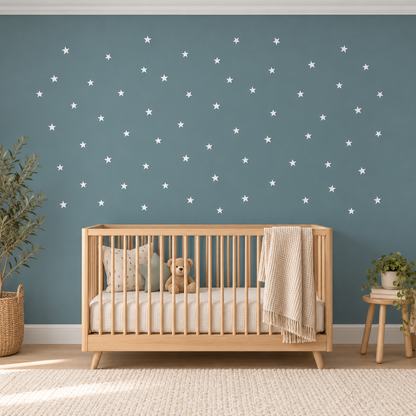 Small white star wall decal set in a modern blue nursery