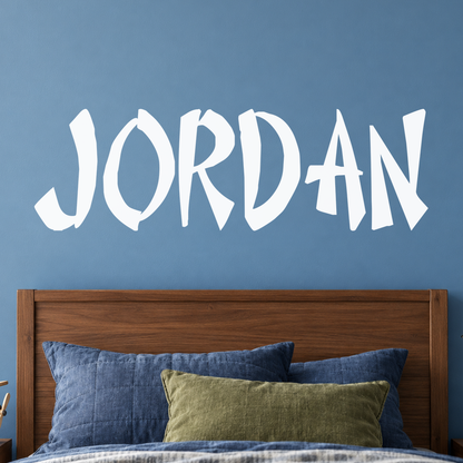 Close-up custom lettering example on a smooth wall