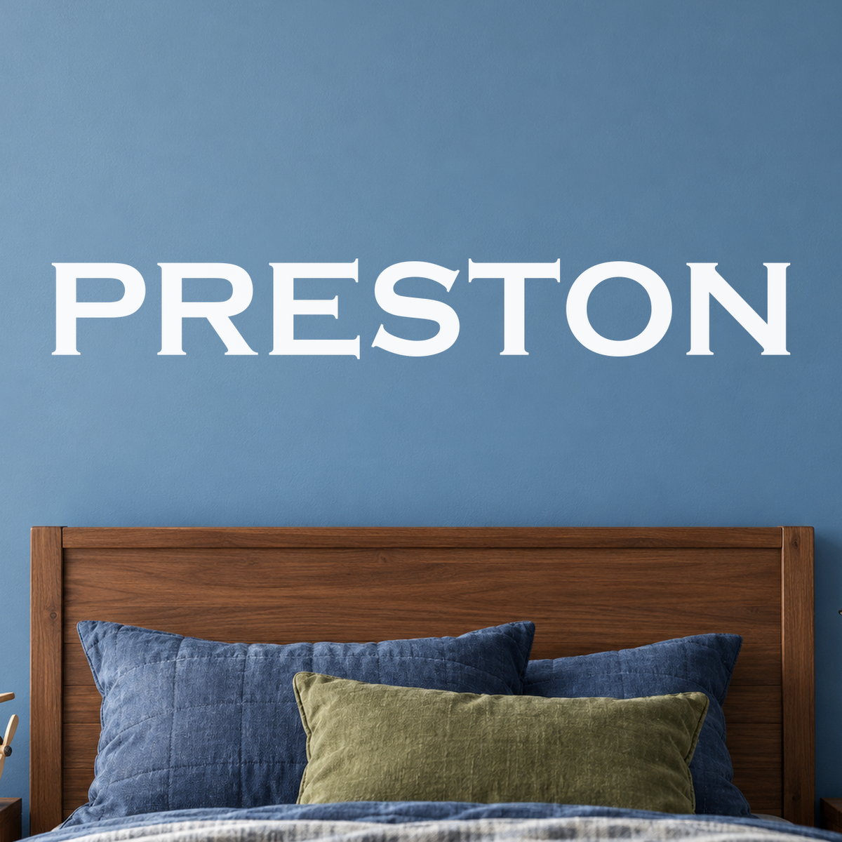 Close-up custom lettering example on a smooth wall
