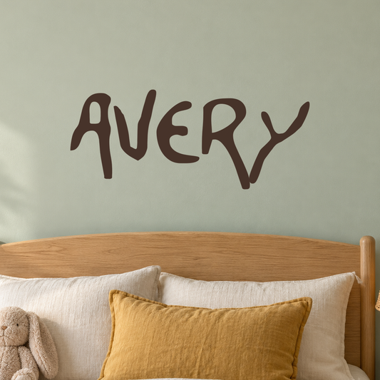 Close-up custom lettering example on a smooth wall