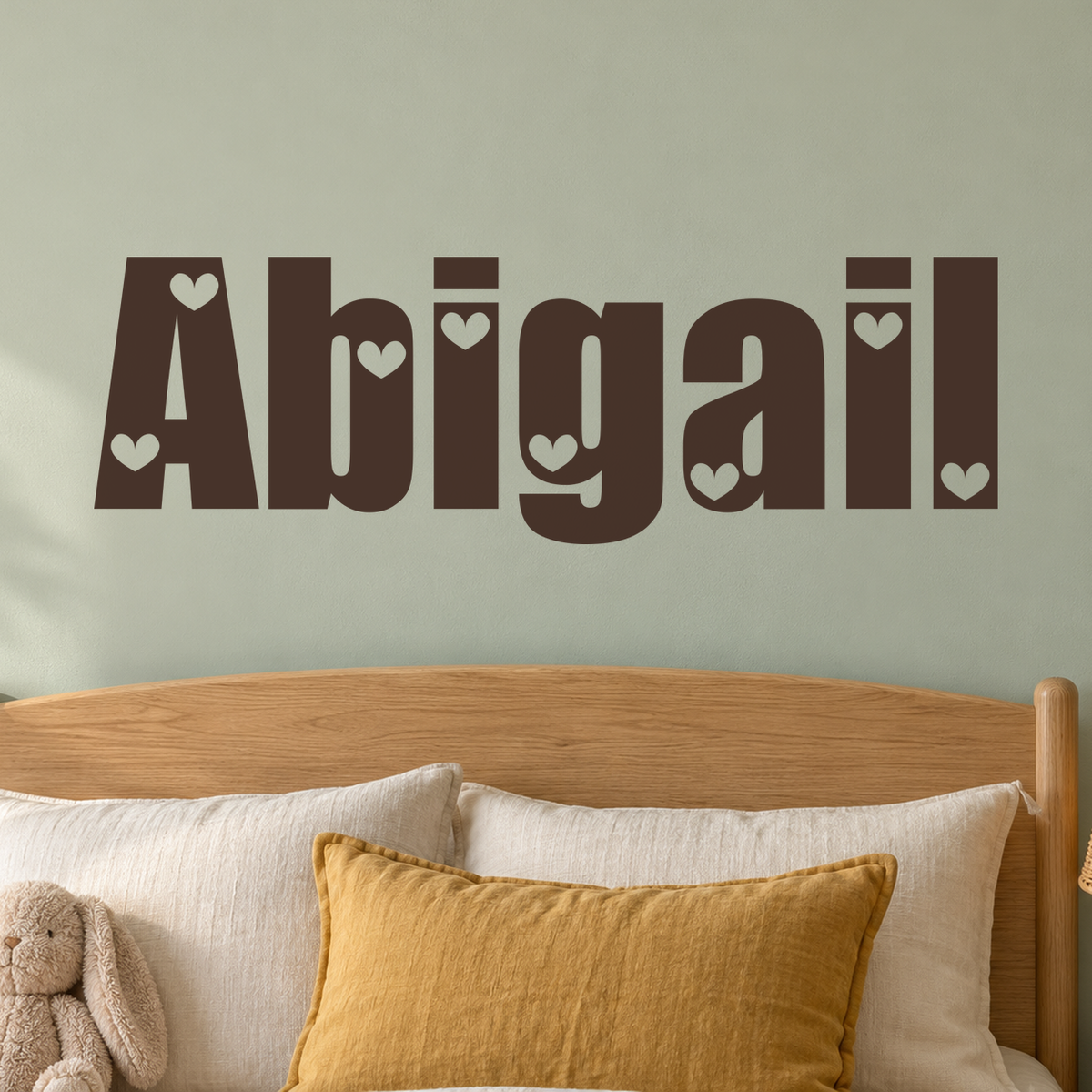 Close-up custom lettering example on a smooth wall